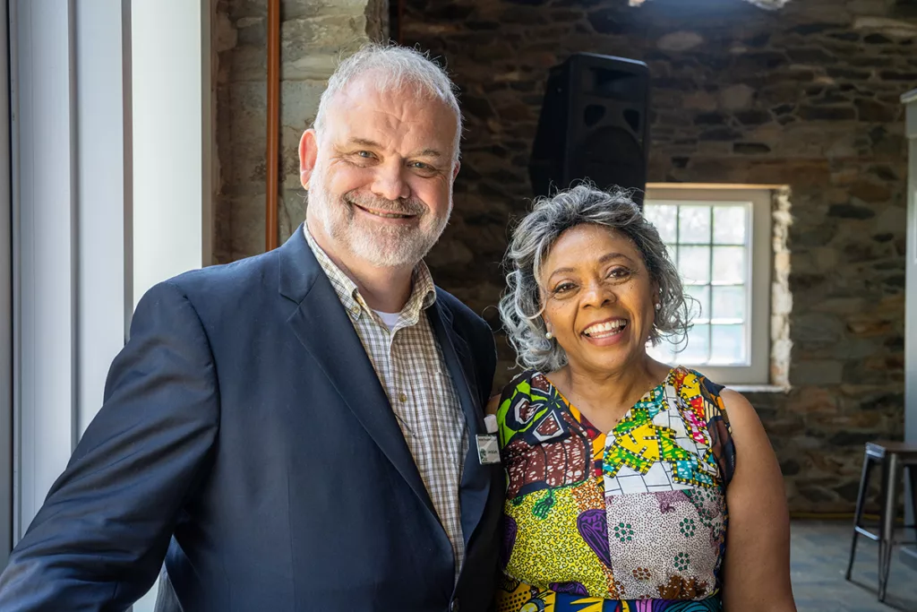 A man and woman pose for the camera