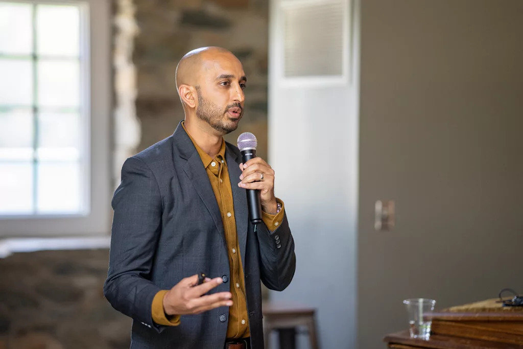 man speaks into a microphone