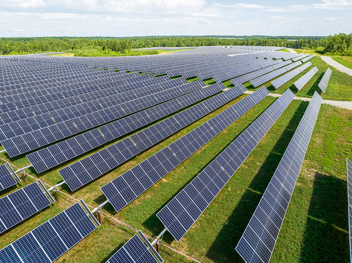 a large field filled with rows of solar panels