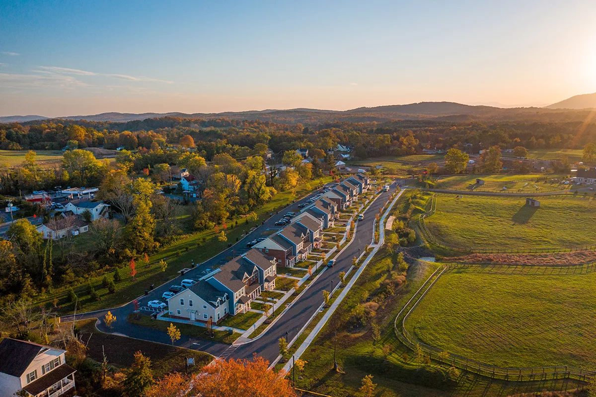 row of multifamily housing in green rural area