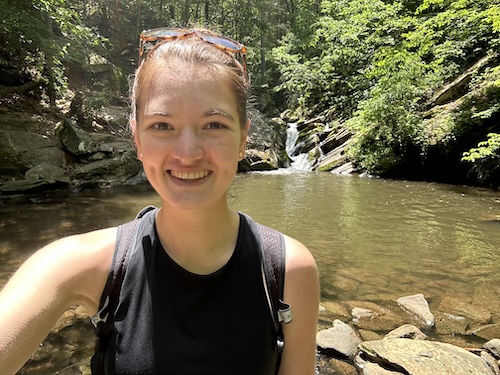 A selfie of someone in the woods next to a spring-fed pool.