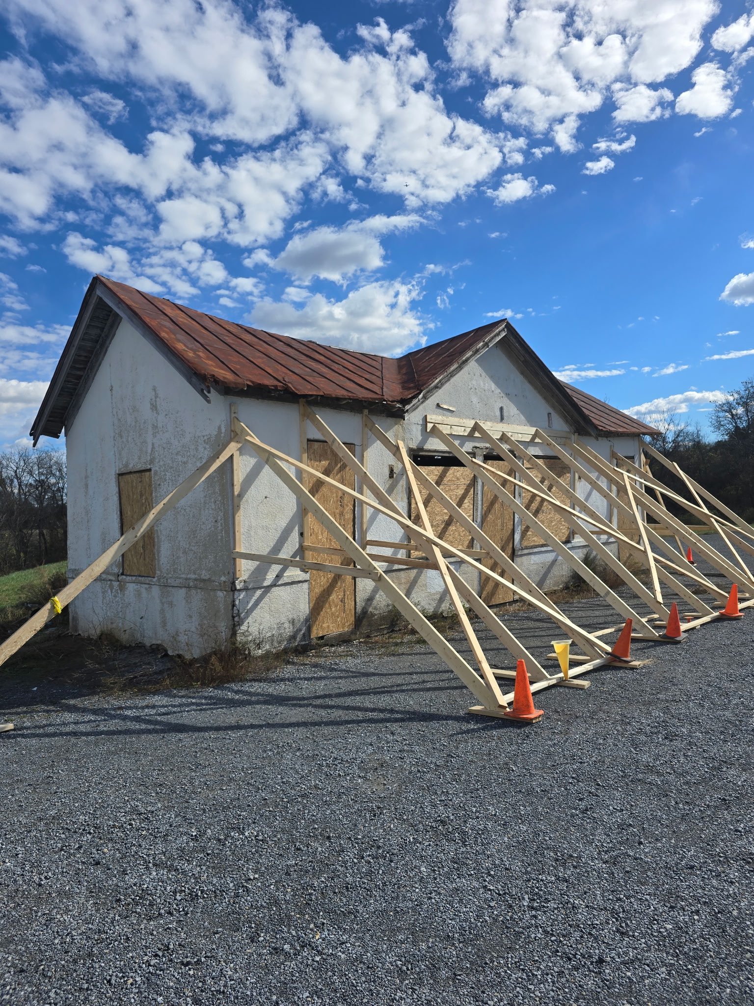 The unstable structure at Gilberts Corner Market, being held up by supportive beams.