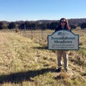 Roundabout Meadows sign in front of a meadow