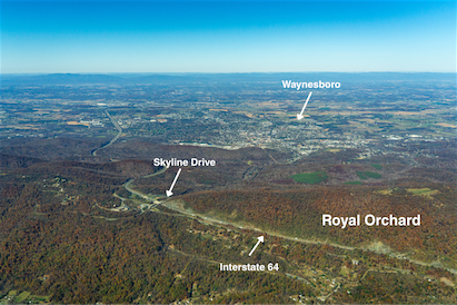 An aerial view of the landscape with labels showing the Royal Orchard property adjacent to Interstate 64 and Skyline Drive, with Waynesboro labeled beyond the mountain ridge.