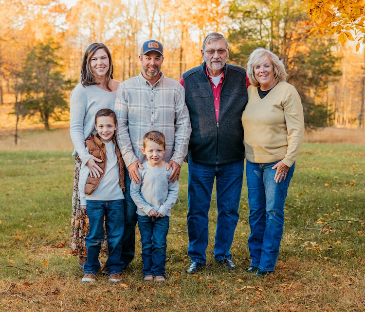 Family portrait in autumn setting.