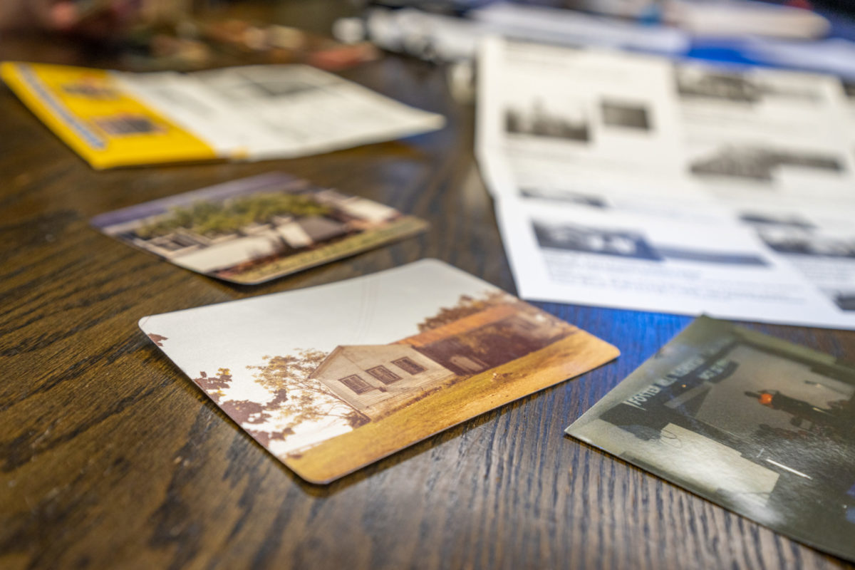 A historical image of a building, set on a table.