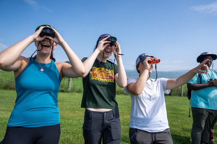 People looking through binoculars