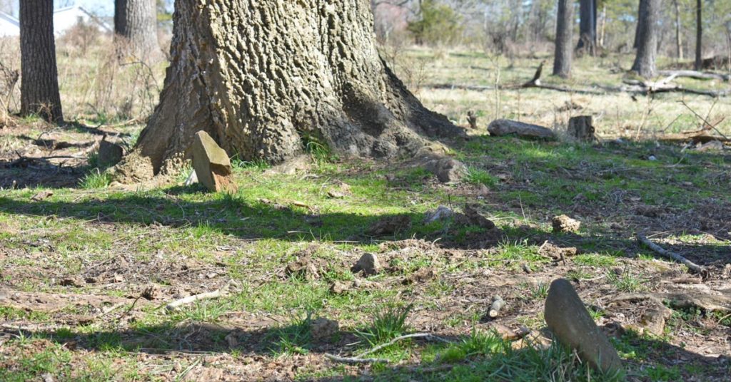 A cemetery with headstones.