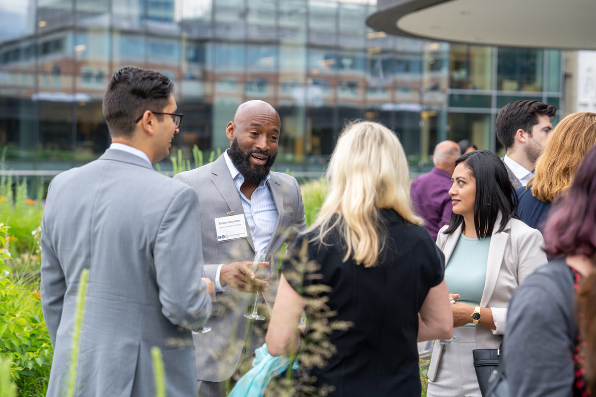 Networking event in outdoor setting.