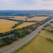aerial image of rural land with a road cutting through