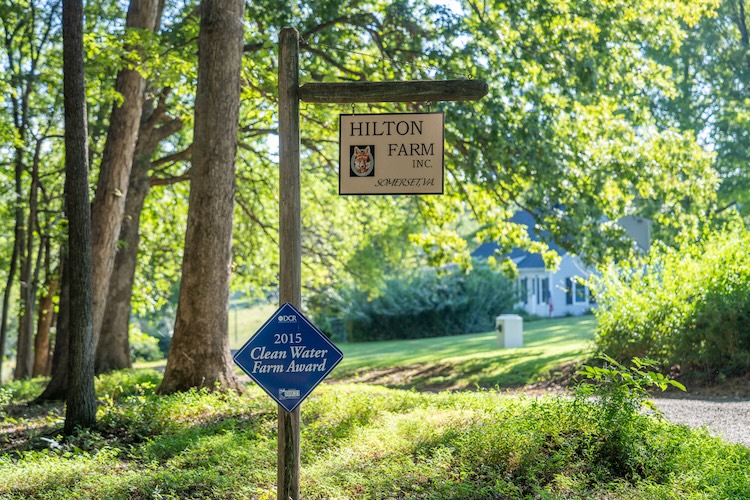 A sign reads "Hilton Farm, Inc. Somerset, VA". Below that, a separate sign reads "2015 Clean Water Farm Award"