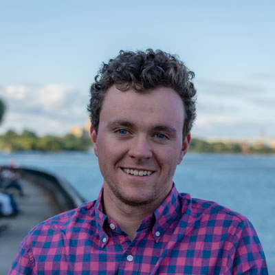 portrait of a man with water in the background