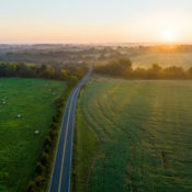 aerial image of a sunrise over green rural fields