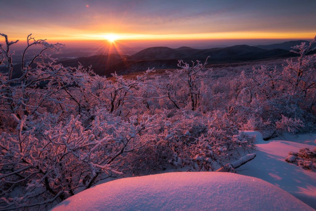 View of a snowy landscape at sunrise from Shenandoah National Park