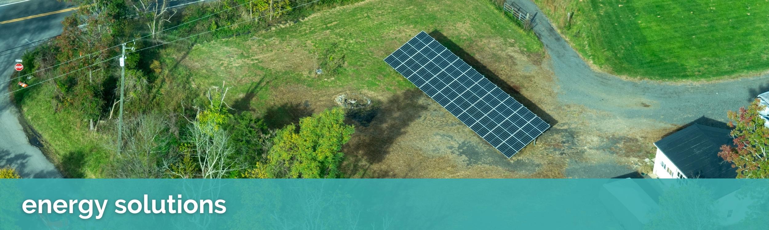 image banner of a residential solar array in a backyard with text that reads "energy solutions"